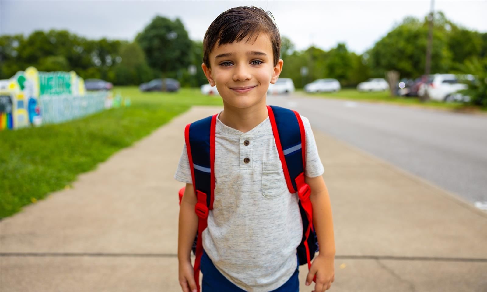 A boy smiles